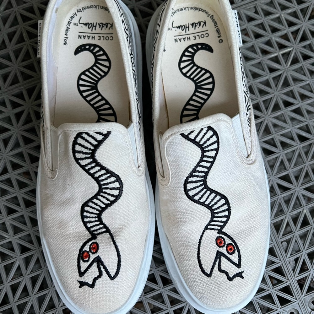 Cole Haan Cream Slip-On Shoes with Black Snake Design